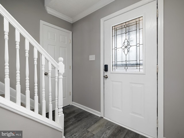 entrance foyer with stairs, crown molding, baseboards, and dark wood-style flooring