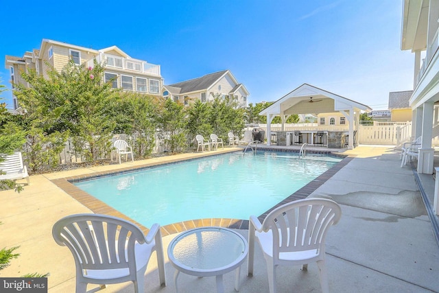 view of swimming pool featuring a fenced in pool, a patio, and a fenced backyard