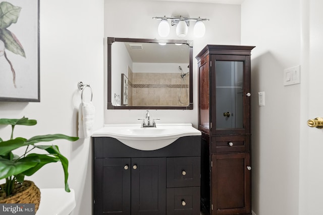 full bath featuring vanity and walk in shower