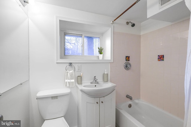 full bathroom with shower / bath combination, toilet, visible vents, and vanity