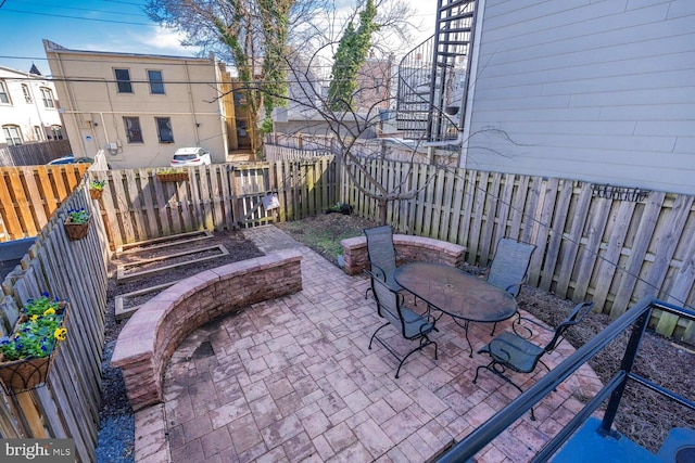 view of patio featuring outdoor dining area and a fenced backyard