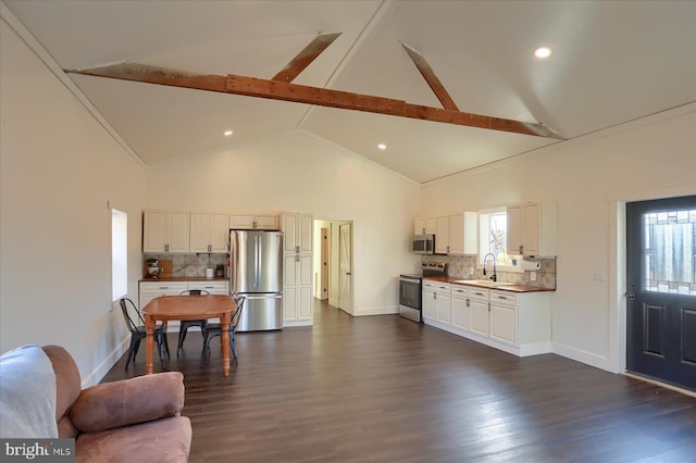 kitchen with backsplash, stainless steel appliances, dark wood-type flooring, and a sink