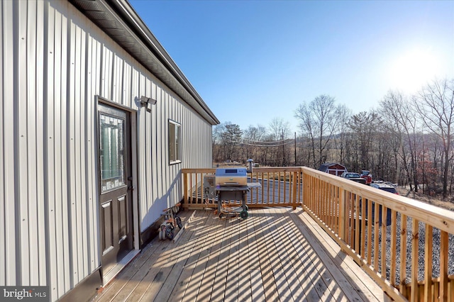 wooden terrace featuring grilling area