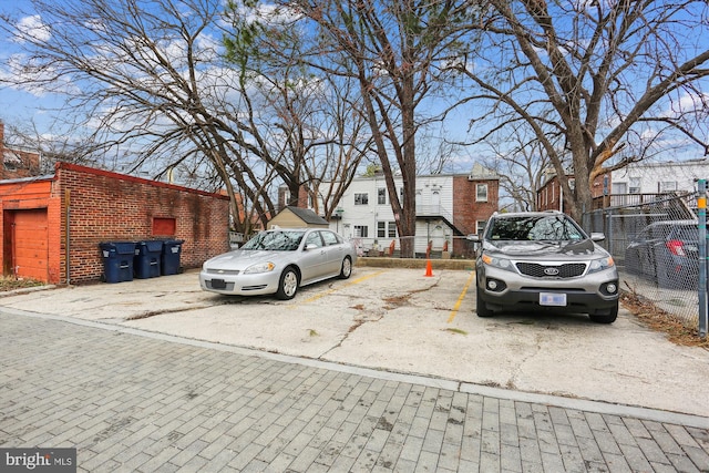 uncovered parking lot with fence