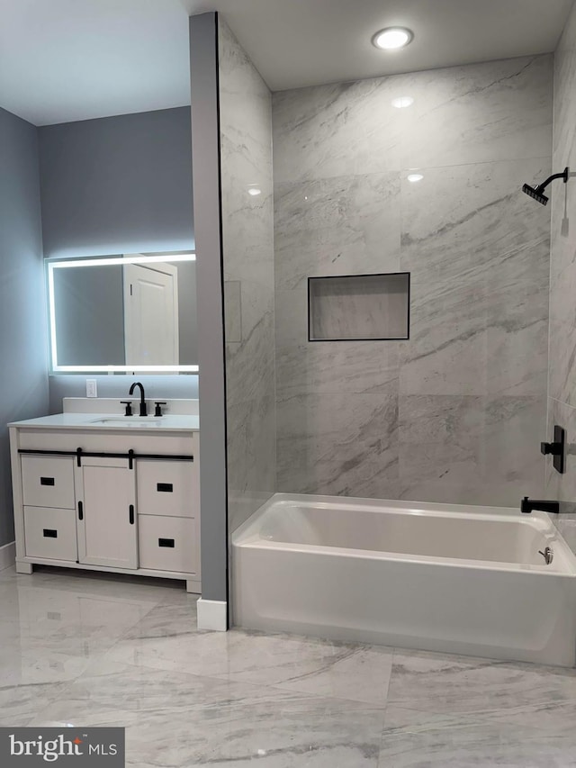 bathroom featuring bathtub / shower combination and vanity