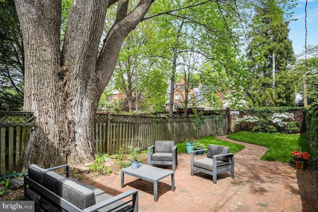 view of patio with outdoor lounge area and a fenced backyard