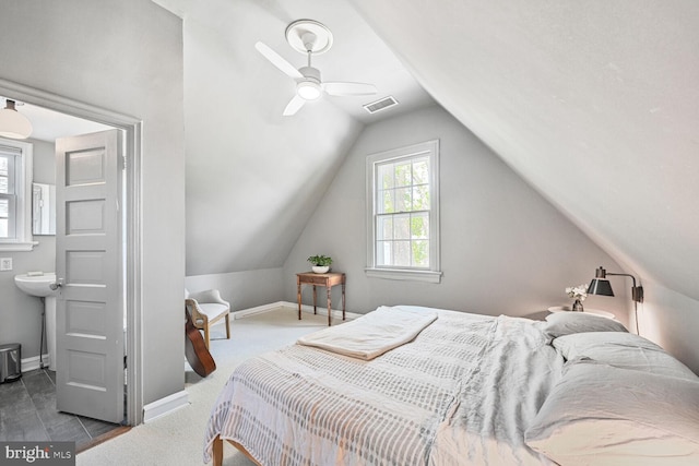 bedroom featuring visible vents, lofted ceiling, and baseboards