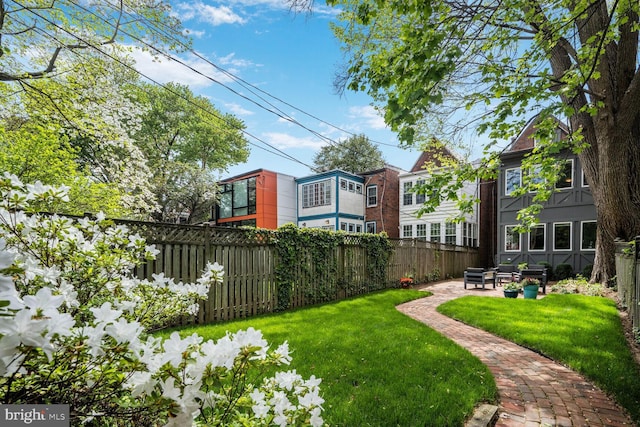view of yard featuring a patio and fence