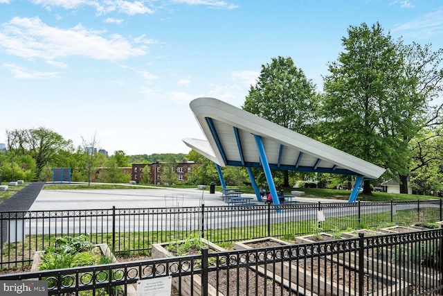 view of community featuring fence