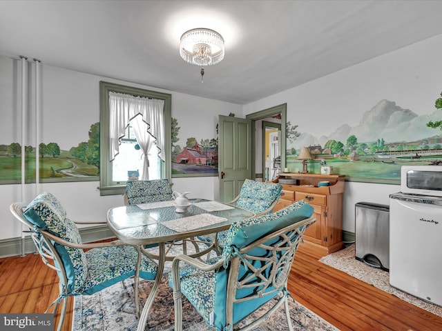 dining area featuring light wood-type flooring