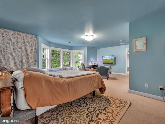 bedroom with carpet and baseboards