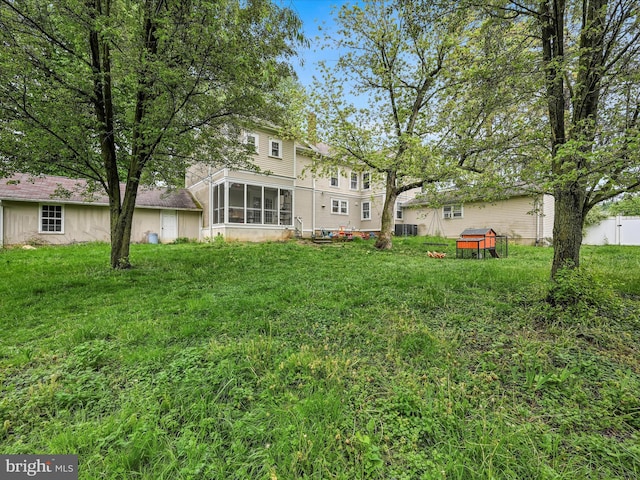 view of yard with a sunroom