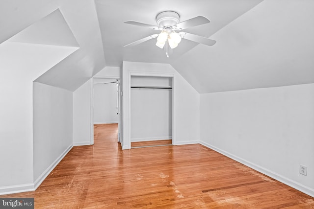 additional living space with ceiling fan, lofted ceiling, and wood finished floors