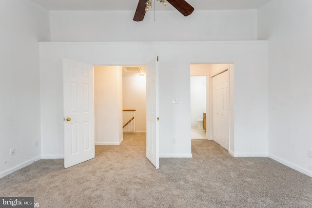 unfurnished bedroom featuring beamed ceiling, baseboards, and carpet flooring