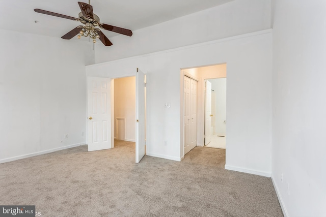 unfurnished bedroom featuring baseboards, carpet, and ceiling fan