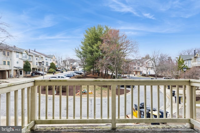 wooden terrace featuring a residential view