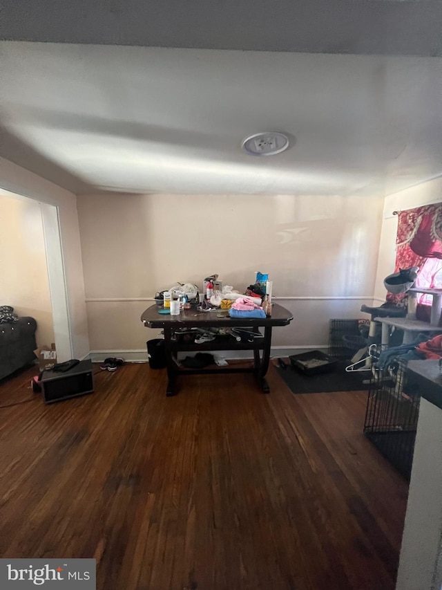 dining space with wood finished floors