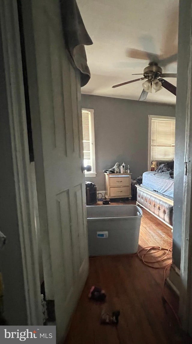 bedroom featuring ceiling fan and wood finished floors