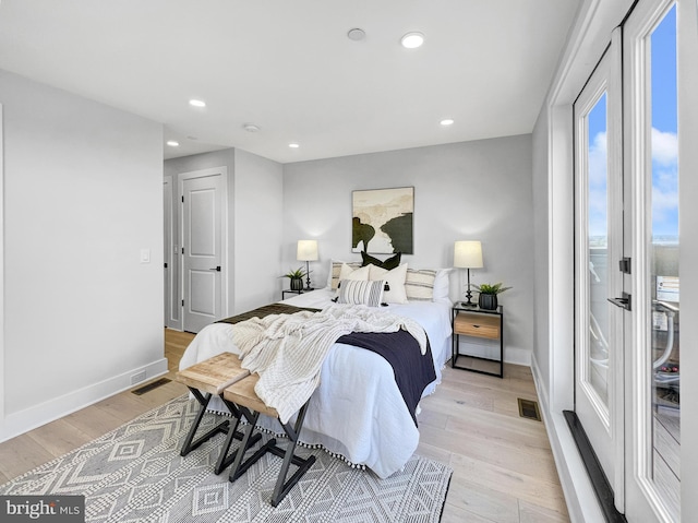 bedroom with light wood-style flooring, recessed lighting, visible vents, and baseboards