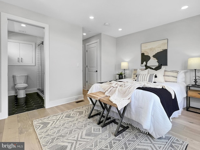 bedroom featuring recessed lighting, visible vents, baseboards, and wood finished floors