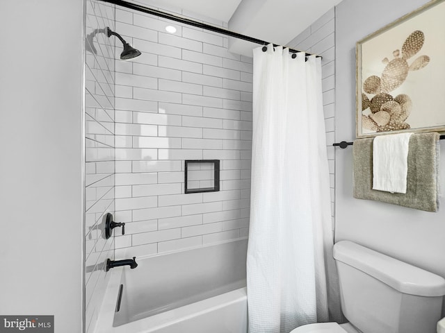 bathroom featuring toilet and shower / tub combo