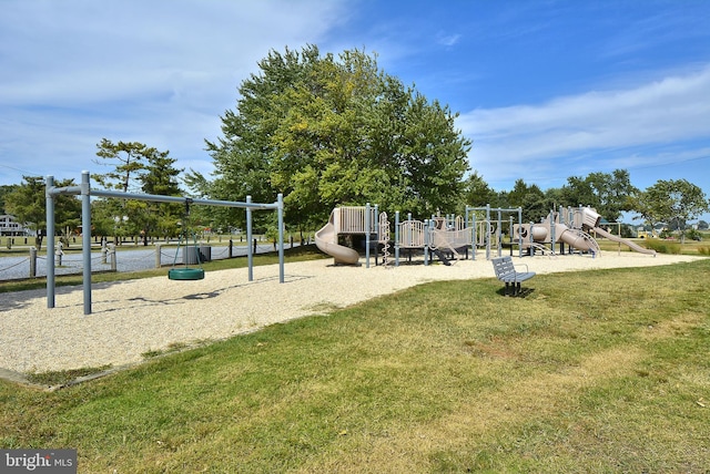 community jungle gym featuring a yard