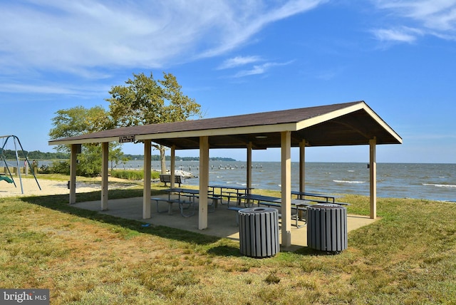 view of community with a gazebo, a yard, and a water view