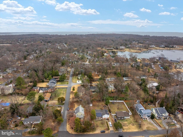 drone / aerial view with a water view and a residential view