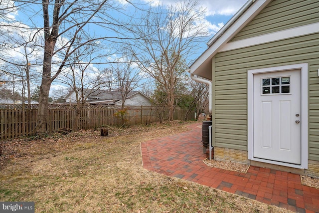 view of yard featuring a patio and fence