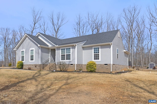 ranch-style house featuring crawl space, roof with shingles, and a front lawn