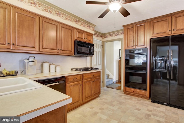 kitchen featuring light floors, light countertops, brown cabinets, black appliances, and a ceiling fan