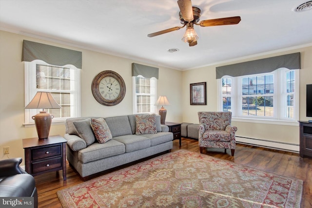 living area with a ceiling fan, visible vents, a baseboard radiator, ornamental molding, and wood-type flooring