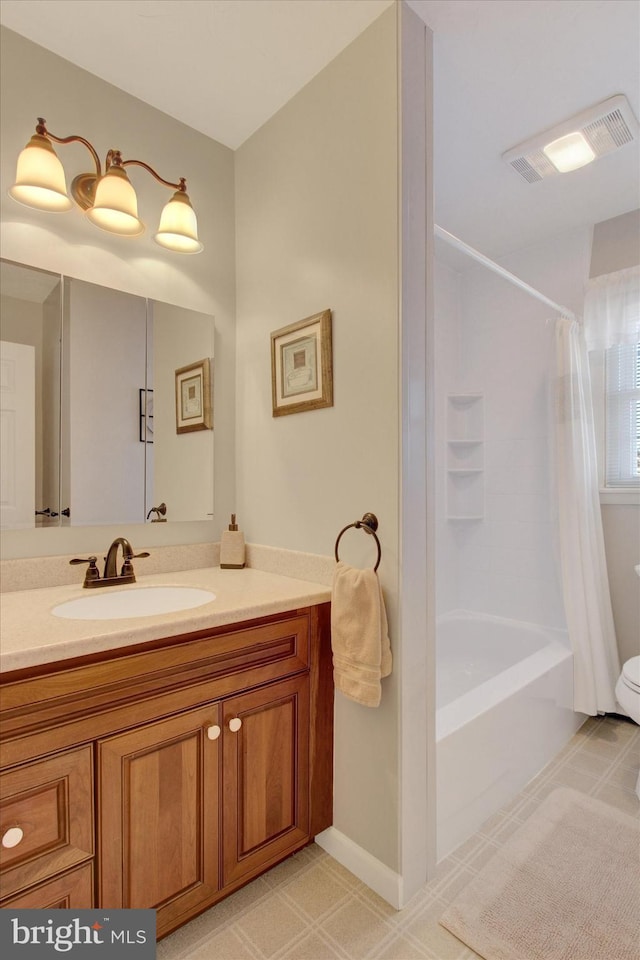 bathroom featuring vanity, shower / bath combo with shower curtain, and visible vents