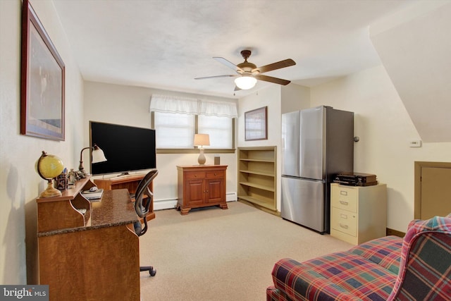 bedroom featuring a baseboard heating unit, baseboards, light colored carpet, freestanding refrigerator, and a ceiling fan