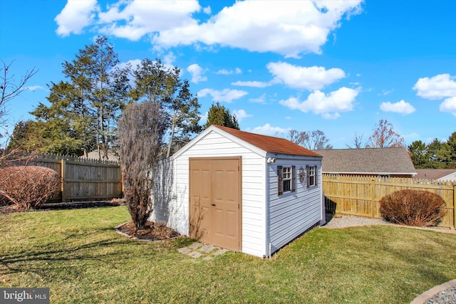 view of shed with a fenced backyard