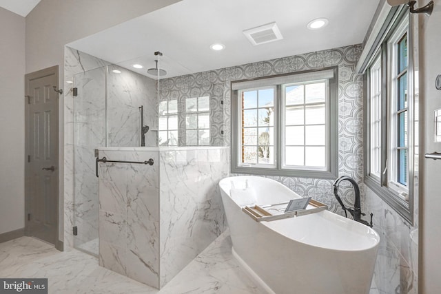 bathroom featuring a soaking tub, visible vents, marble finish floor, and a marble finish shower