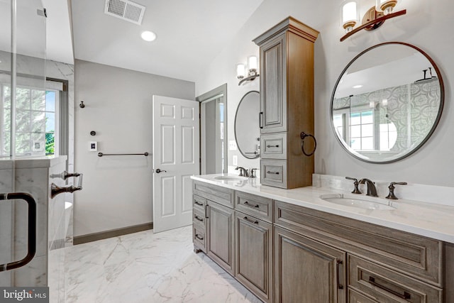 full bath with a sink, visible vents, baseboards, and marble finish floor