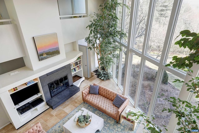 living area with a glass covered fireplace