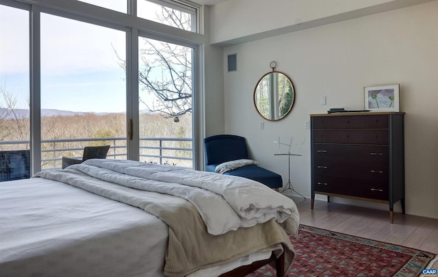 bedroom featuring hardwood / wood-style flooring