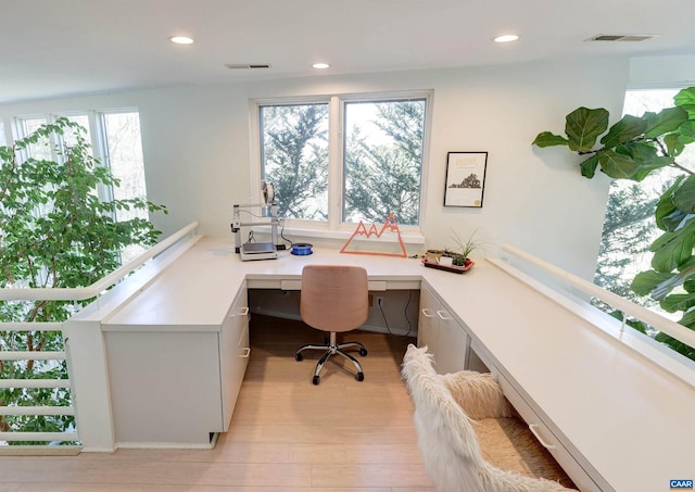 office with visible vents, recessed lighting, built in study area, and light wood-style flooring