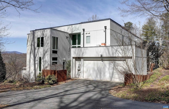 view of front of home with driveway and a garage