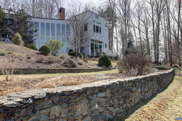 view of home's exterior featuring a chimney