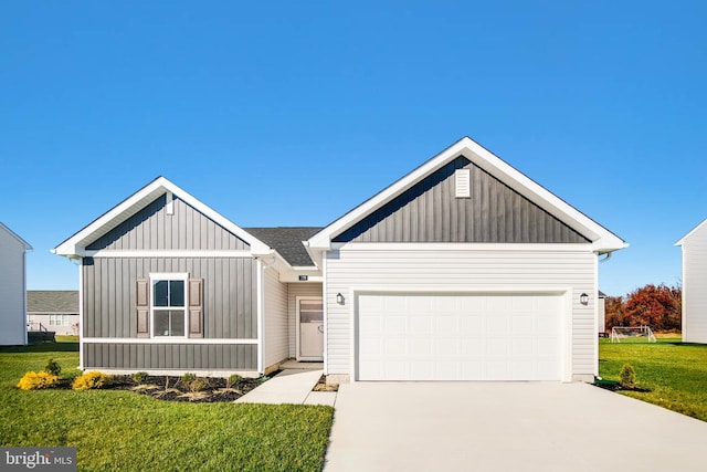 view of front of home featuring board and batten siding, a front yard, a garage, and driveway