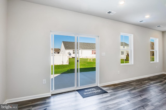 entryway with visible vents, recessed lighting, baseboards, and wood finished floors