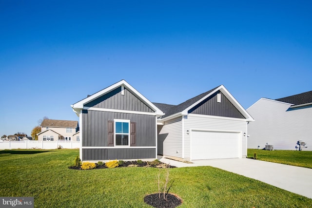 view of front of home featuring board and batten siding, a front lawn, fence, a garage, and driveway