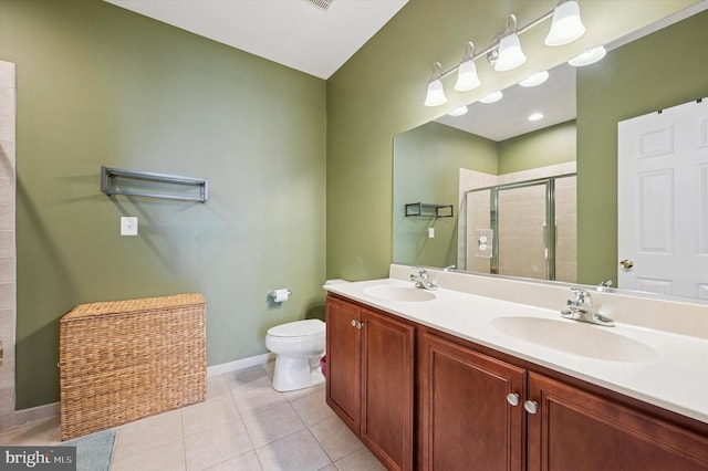 full bath with baseboards, a sink, toilet, and a shower stall