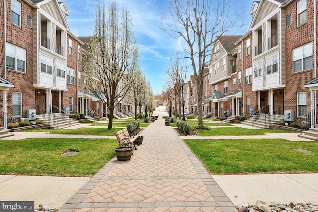 surrounding community featuring a residential view and a yard
