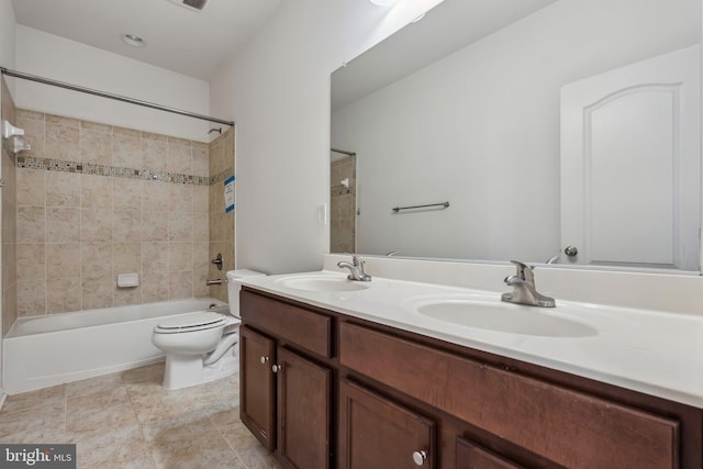 bathroom with double vanity, toilet, shower / bathing tub combination, and a sink