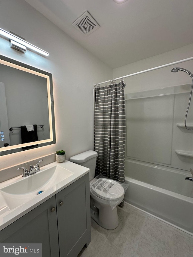 bathroom featuring visible vents, toilet, vanity, and shower / bath combination with curtain