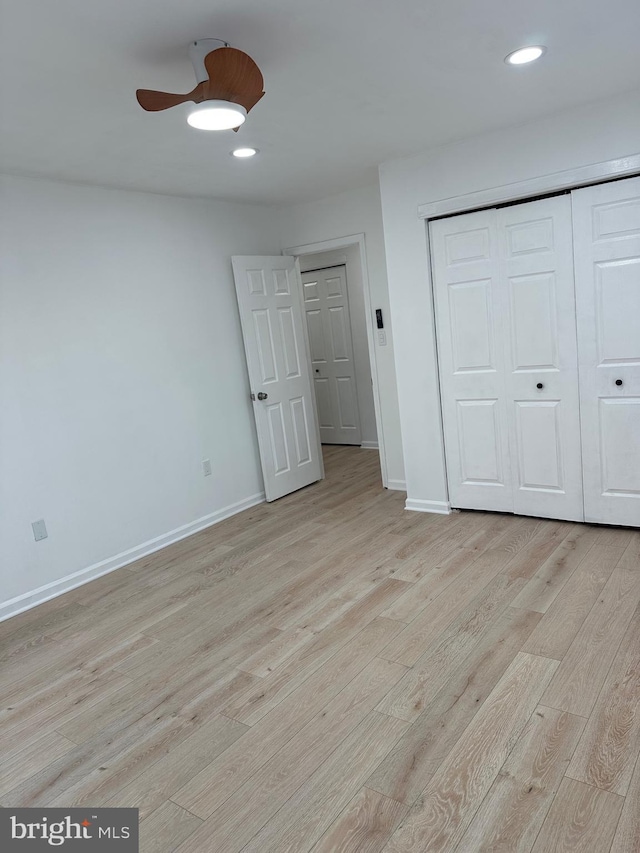 unfurnished bedroom with recessed lighting, baseboards, and light wood finished floors